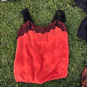 Thrifted orange top with black lace straps